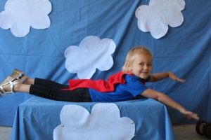 I set up a "photobooth" for the kids to pretend they were superheroes flying through the sky. 